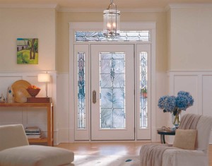 The glass door gives this entry natural light, while the furnishings, flowers and artwork add warmth.