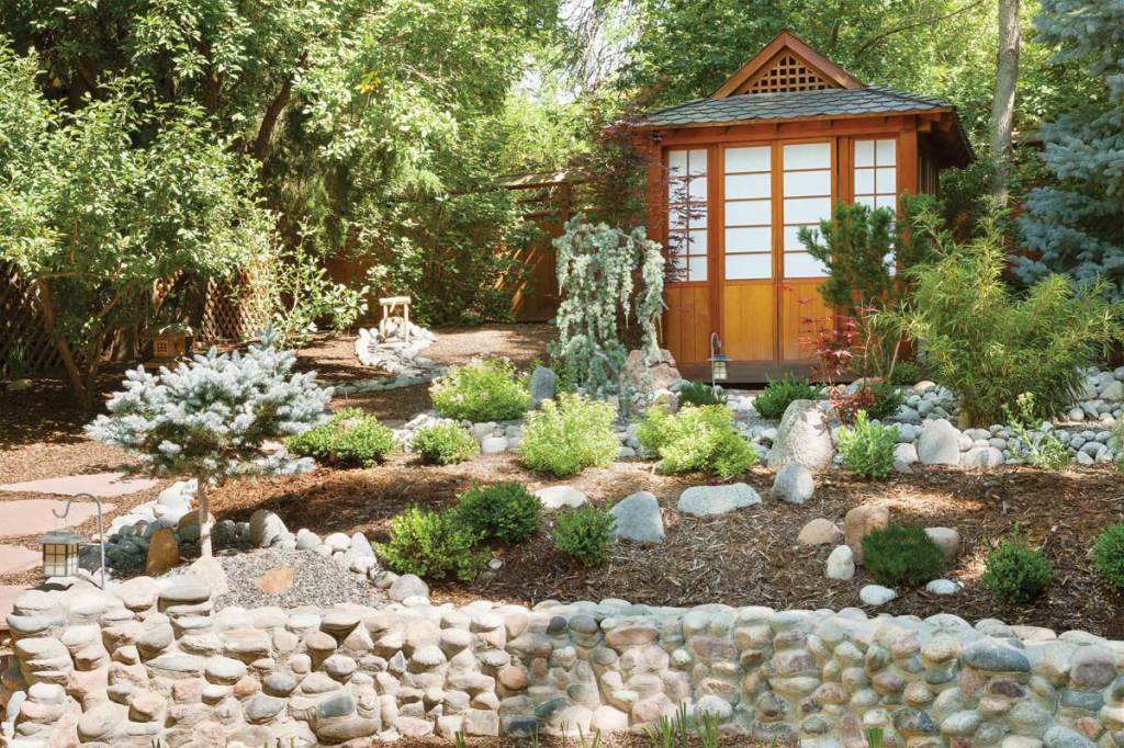 Terraced stone walls, Asian plantings and a traditional Japanese teahouse give this garden a meditative quality.