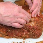 Pat the meat dry and moisten it with a light sheen of olive oil to soften the spices and help them adhere. 