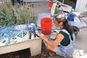 Jane Glotzer working on the bench (photo courtesy Jane Glotzer, www.plainjanedesignboulder.com)