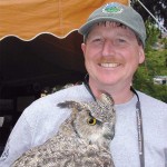 Sutherland shows off a (stuffed) great horned owl at the Boulder Creek Fest. 