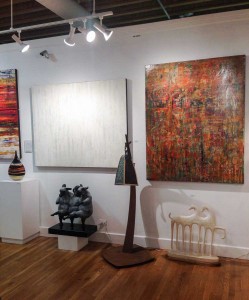 Abstract acrylic paintings by Hilario Gutierrez have been a popular new addition to the gallery. The three shown above are, left to right, “When You Come This Way,” “Suddenly Quiet” and “Jewel at My Feet.” On the floor, the three little sheep are by Giuseppe Palumbo and the horses are by Linda Raynolds.