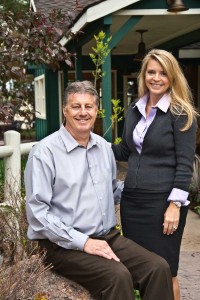 Owners Phil and Emma Goddard in front of the Inn.