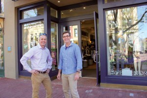 Sean Maher (left) of Downtown Boulder Inc. visits with John Shopbach, owner of Weekends, which started out selling jeans in 1990 and now offers contemporary casual clothing.