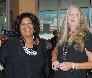 Lyle (left) with business manager Mary Schmidt at the 20th-annual Penfield Tate Humanitarian Awards Dinner and Auction, the center’s major fundraising event. (photo courtesy Family Learning Center)