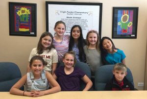 Above: When High Peaks Elementary students learned that 200 Sengma children were displaced (right) and had no school, eight of them teamed up to help by selling chai. The High Peaks students left to right are: Eliza, Charlie, Peyton, Delanie, Olivia, Sierra and Zoey (all 5th-graders) and Sloan (3rd grade). (photo by Steve Wilke)