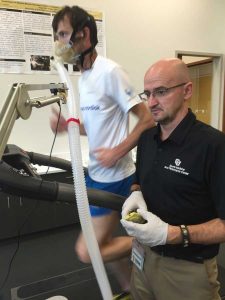 Human Performance Lab director Iñigo San Millan tests Tommy Neal, a highly competitive Type 1 diabetic athlete who is one of the best endurance runners in Colorado. Neal breathes through the mask for gas exchange collection. The lab analyzes all the gases for different metabolic parameters to see how efficient he is and what his training zones parameters are as part of his personalized exercise training program. (Photo courtesy CU Sports Medicine Performance Center)