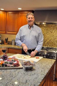 Before an outdoor winter adventure with his family, Philip Goddard grabs his favorite knife and prepares a roast that will be ready when the gang returns home. (Photo by BirdGodd Photography) 