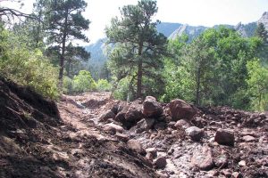 As the floodwaters waned, piles of cobbles, pebbles and sand up to several feet thick accumulated in the river channels, such as McClintock Creek, above. (Photos by Lon Abbott and Terri Cook)